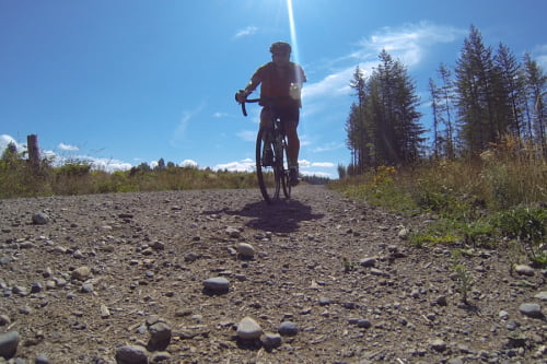 image of rider on a gravel road approaching