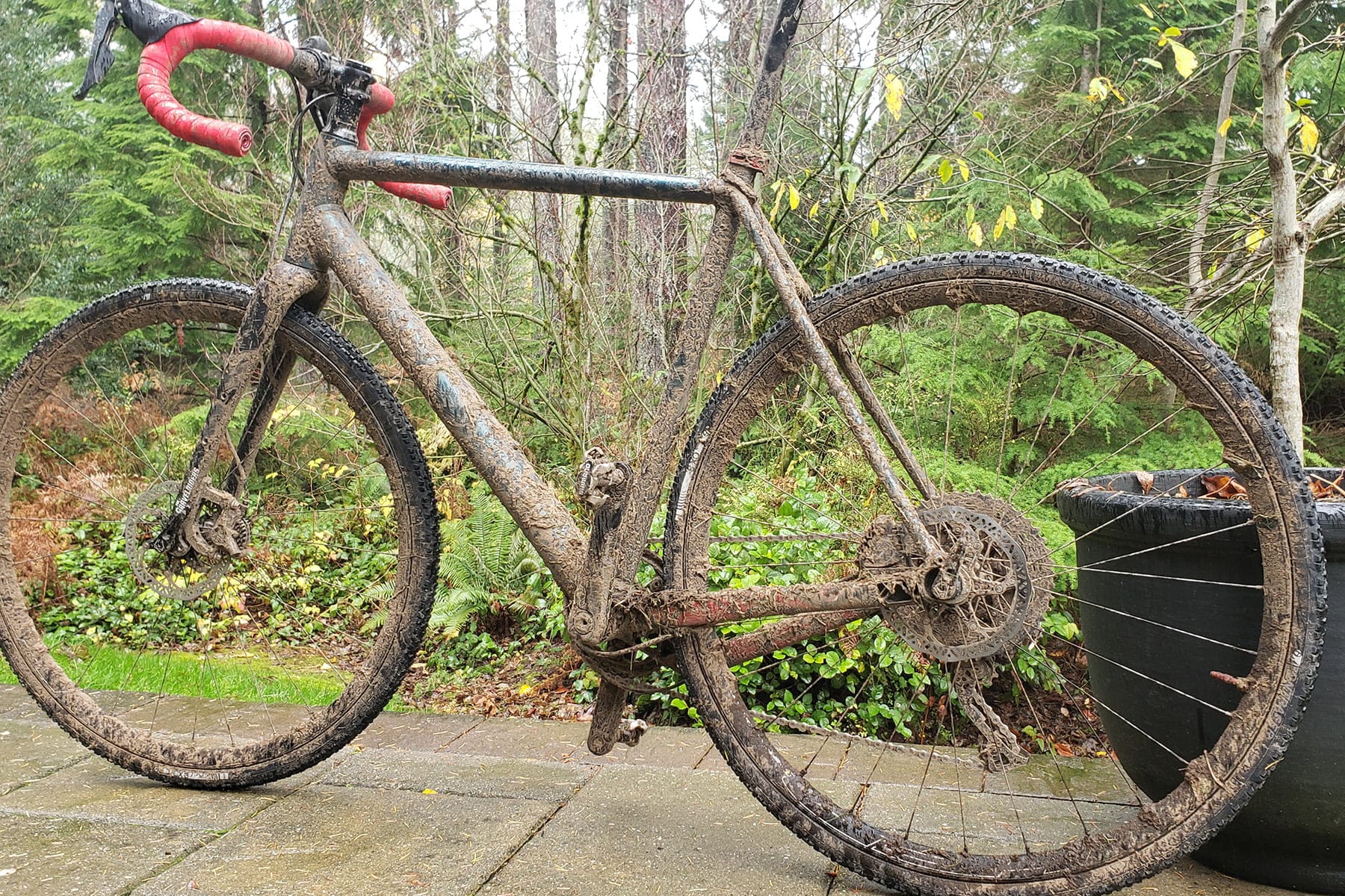 Mud-covered gravel bike after a wet Pacific Northwest ride
